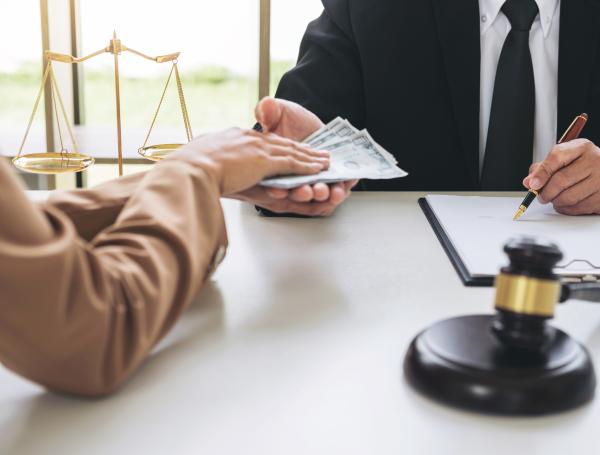 Lemon law settlement compensation being reviewed during a legal case