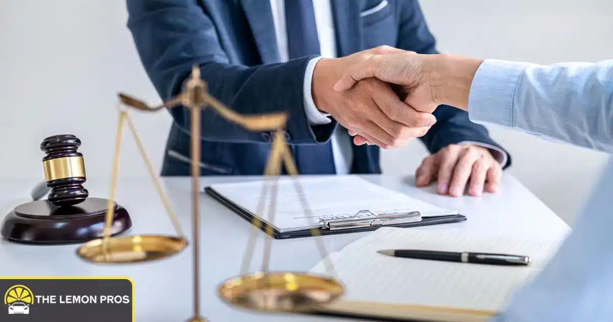 California truck lemon law attorney finalizing a legal agreement with a client