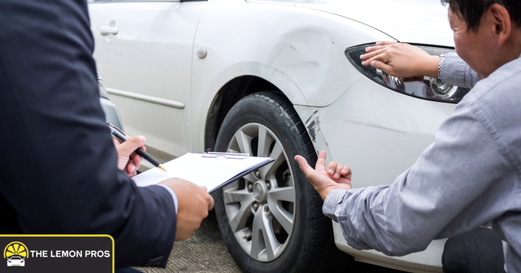 Assessors inspecting body damage on a vehicle.